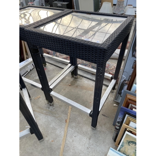 2195 - A TALL RATTAN GARDEN TABLE WITH GLASS TOP