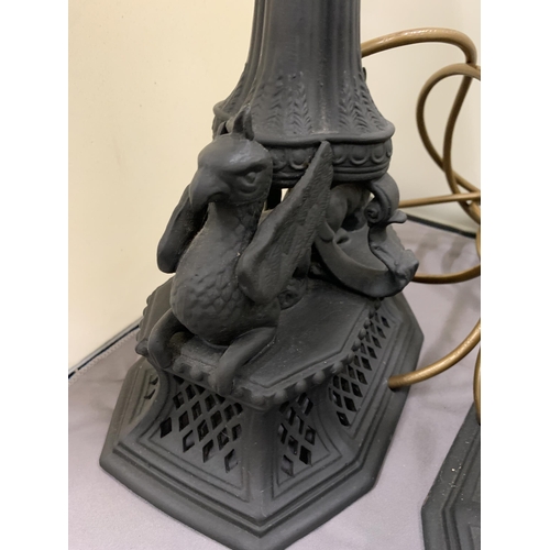 40 - A PAIR OF BLACK CERAMIC LAMPS WITH DOUBLE SPHINX DESIGN