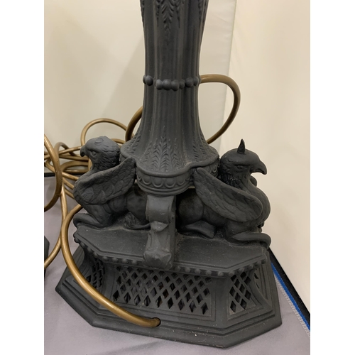 40 - A PAIR OF BLACK CERAMIC LAMPS WITH DOUBLE SPHINX DESIGN