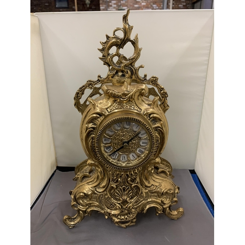 44 - AN ORNATE GILT MANTLE CLOCK WITH ROMAN NUMERALS