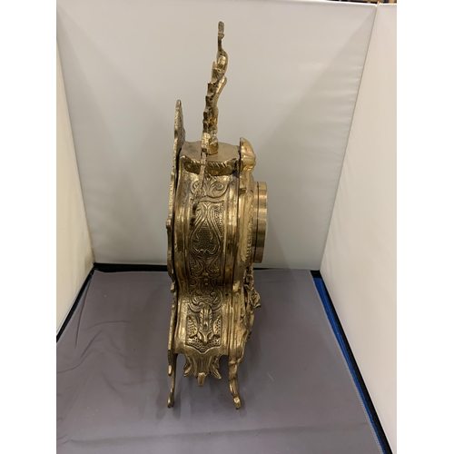 44 - AN ORNATE GILT MANTLE CLOCK WITH ROMAN NUMERALS