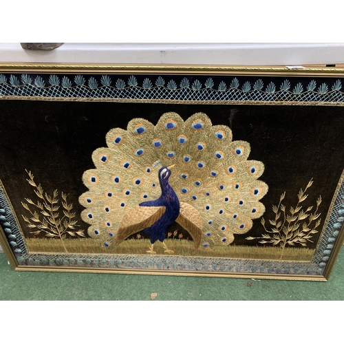 54 - A LARGE GILT FRAMED EMBROIDERED COLLAGE OF A PEACOCK