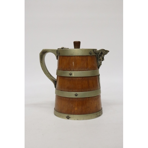 64 - AN OAK AND SILVER PLATED BANDED ICE WATER JUG - 23CM (H)