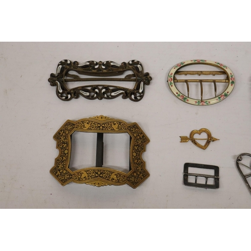 66 - A COLLECTION OF VINTAGE METAL AND ENAMEL BELT BUCKLES