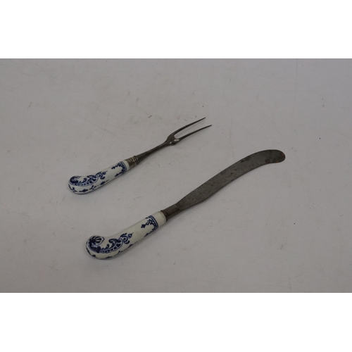 75 - A LATE 18TH CENTURY DELFT PISTOL HANDLED KNIFE AND FORK