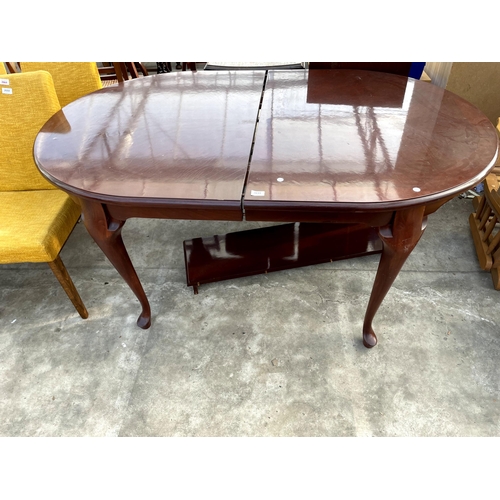 2691 - A MAHOGANY EXTENDING DINING TABLE ON CABRIOLE LEGS