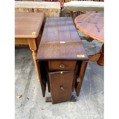 2712 - A JARMAN AND PLATT MID 20TH CENTURY OAK DROP LEAF DINING TABLE ENCLOSING TWO DRAWERS AND TWO CUPBOAR... 