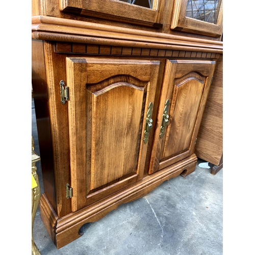 2716 - A MODERN BEECH CORNER CUPBOARD WITH GLAZED AND LEADED UPPER PORTION