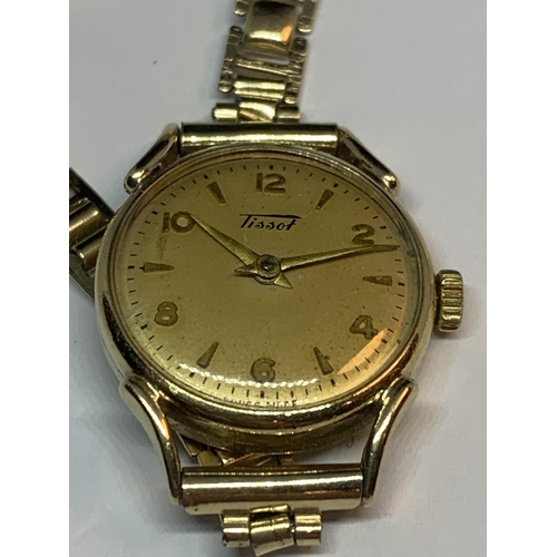 550A - AN 9 CARAT GOLD CASED TISSOT WATCH