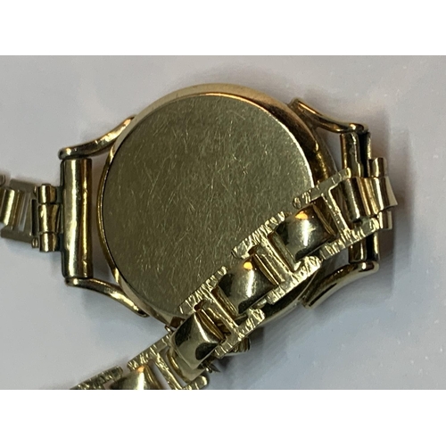 550A - AN 9 CARAT GOLD CASED TISSOT WATCH