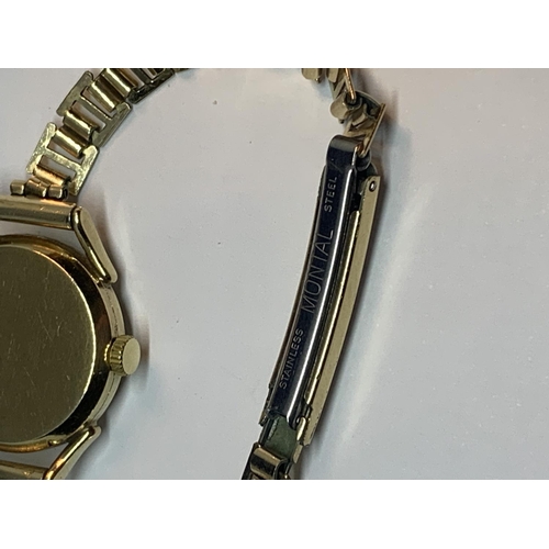 550A - AN 9 CARAT GOLD CASED TISSOT WATCH