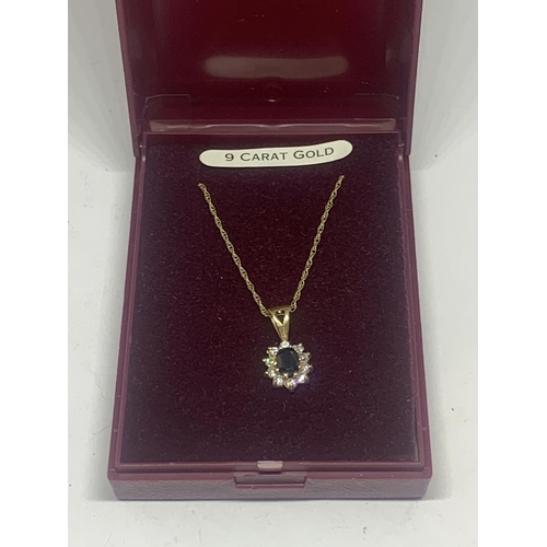 664 - A 9 CARAT GOLD NECKLACE WITH A SAPPHIRE AND CUBIC ZIRCONIA PENDANT GROSS WEIGHT 1.54 GRAMS IN A PRES... 