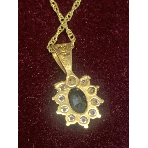 664 - A 9 CARAT GOLD NECKLACE WITH A SAPPHIRE AND CUBIC ZIRCONIA PENDANT GROSS WEIGHT 1.54 GRAMS IN A PRES... 