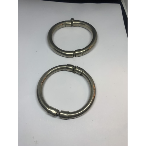 678 - TWO WHITE METAL BANGLES