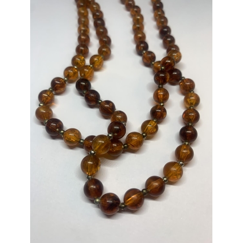 681 - AN AMBER NECKLACE