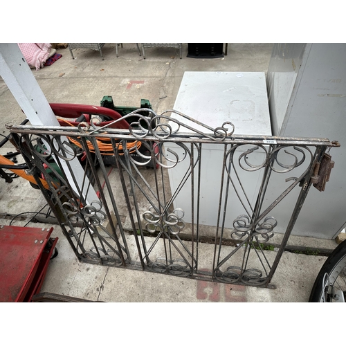 2230 - A PAIR OF WROUGHT IRON DECORATIVE GARDEN GATES