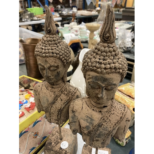 490A - A PAIR OF STONE BUDDAH HEADS ON PLINTHS