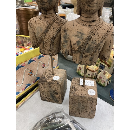 490A - A PAIR OF STONE BUDDAH HEADS ON PLINTHS