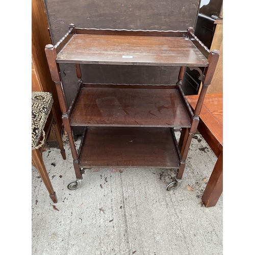 3147 - A MID 20TH CENTURY MAHOGANY THREE-TIER TROLLEY