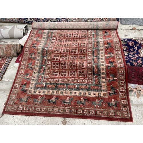 2489 - A RED PATTERNED RUG DEPICTING VARIOUS ANIMALS