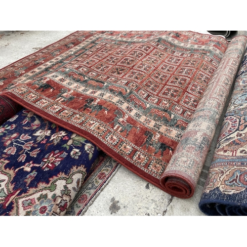 2489 - A RED PATTERNED RUG DEPICTING VARIOUS ANIMALS