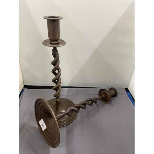 30 - A PAIR OF TWISTED BRONZE CANDLESTICKS