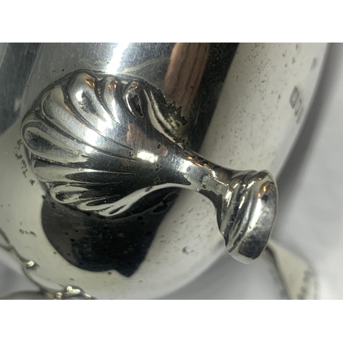 50A - A HALLMARKED LONDON SILVER THREE LEGGED JUG