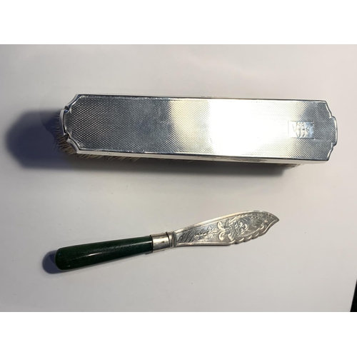 52 - A HALLMARKED BIRMINGHAM SILVER BRUSH AND A MARKED STERLING BUTTER KNIFE