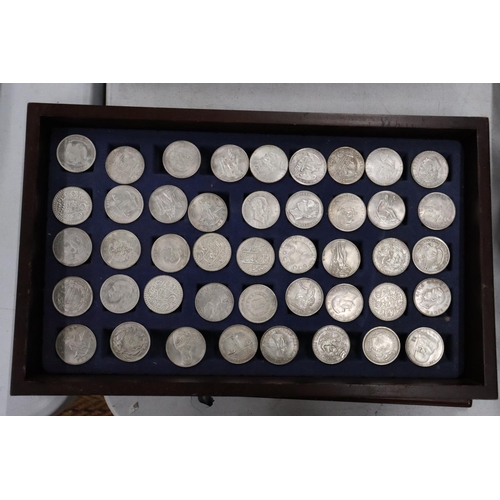 460 - FORTY FOUR VARIOUS VINTAGE TOKENS/COINS IN A WOODEN BOX