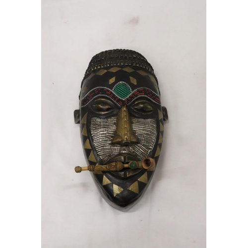 464 - AN AFRICAN TRIBAL MASK, 29CM X 15CM PLUS A VINTAGE HANDMADE TRIBAL WOODEN PIPE