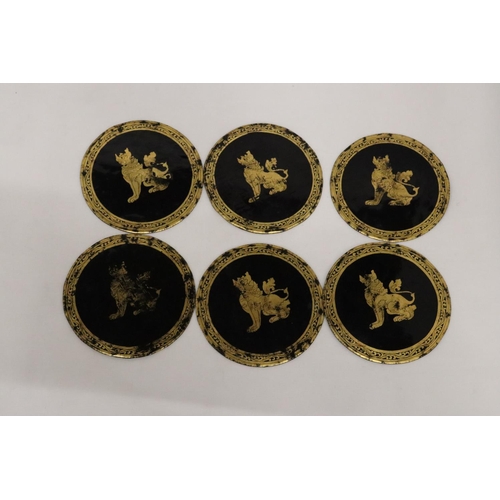 484 - A SET OF SIX ORIENTAL PAPIER MACHE COASTERS