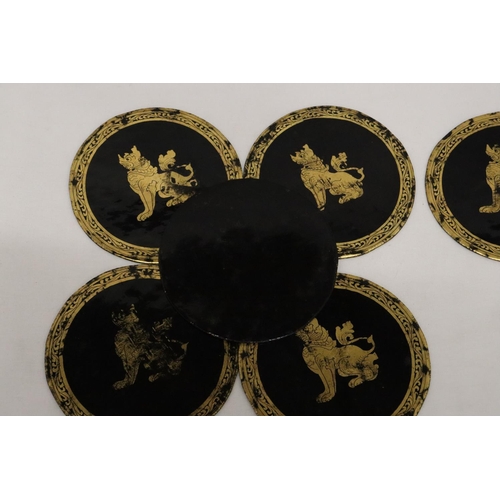 484 - A SET OF SIX ORIENTAL PAPIER MACHE COASTERS