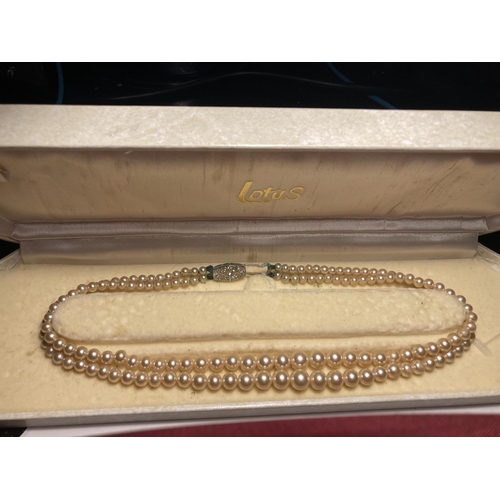 579 - TWO BOXED LOTUS DOUBLE STRAND PEARL NECKLACES