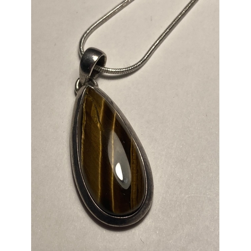 588 - TWO TIGERS EYE NECKLACES ONE WITH PENDANT ON A MARKED SILVER CHAIN