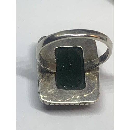 684 - A SILVER MALACHITE DRESS RING IN A PRESENTATION BOX