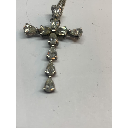 696 - A SILVER CROSS AND CHAIN IN A PRESENTATION BOX