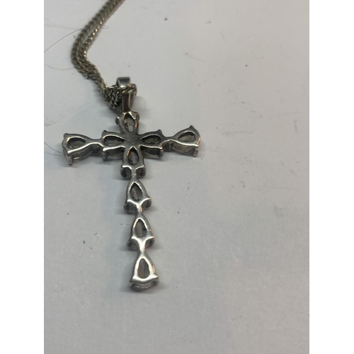 696 - A SILVER CROSS AND CHAIN IN A PRESENTATION BOX