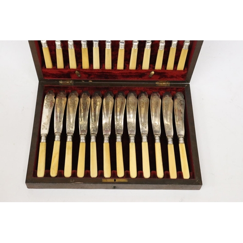 852 - A VINTAGE SET OF FISH KNIVES AND FORKS IN A MAHOGANY BOX WITH HALLMARKED SILVER COLLARS