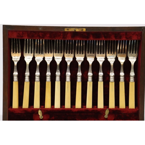 852 - A VINTAGE SET OF FISH KNIVES AND FORKS IN A MAHOGANY BOX WITH HALLMARKED SILVER COLLARS