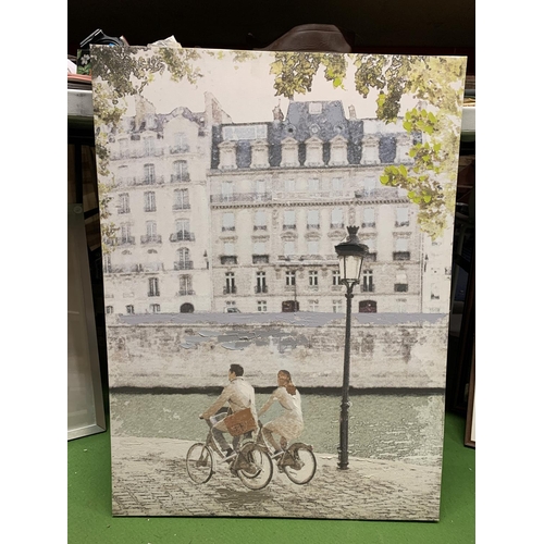 943 - TWO CANVAS PRINTS, A PARISIEN SCENE AND AMSTERDAM CANAL SCENE