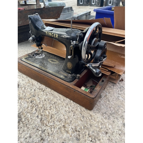 1684 - A VINTAGE SINGER SEWING MACHINE WITH A CARRY CASE