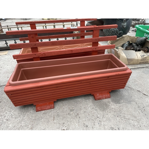 1851 - TWO WOODEN TROUGH PLANTERS WITH PLASTIC LINERS