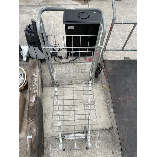 2259 - A METAL FOUR WHEELED MARKET GARDENERS TROLLEY IN WORKING ORDER BUT NO WARRANTY