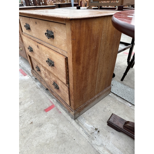 2562 - A LATE VICTORIAN SATINWOOD CHEST OF THREE GRADUATED DRAWERS 36