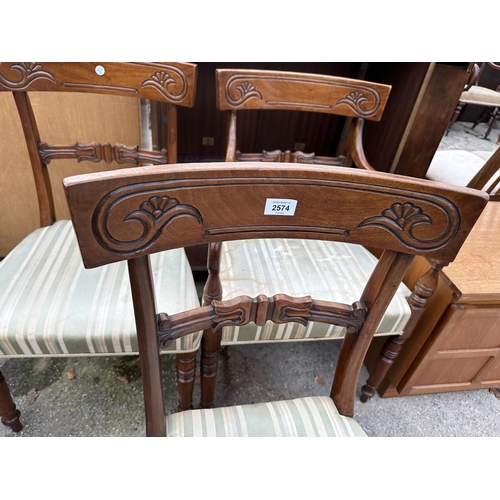 2574 - TWO VICTORIAN MAHOGANY DINING CHAIRS AND MATCHING CARVER