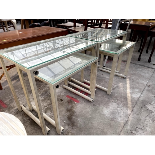 2695 - TWO SETS OF TABLE NEST WITH GLASS TOPS, ON TUBULAR FRAMES