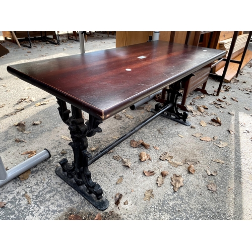 2761 - A COFFEE TABLE ON CAST IRON SCROLLED SUPPORTS, 36 X 16