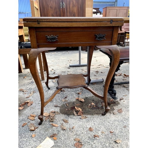 2762 - A LATE VICTORIAN MAHOGANY ENVELOPE CARD TABLE WITH SINGLE DRAWER AND UNDER SHELF