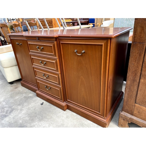 2850 - A PARKER KNOLL BREAKFRONT SIDEBOARD ENCLOSING FOUR DRAWERS, TWO CUPBOARDS AND SLIDE, 50