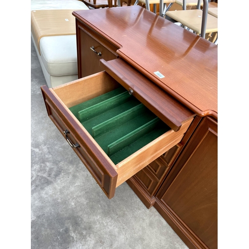 2850 - A PARKER KNOLL BREAKFRONT SIDEBOARD ENCLOSING FOUR DRAWERS, TWO CUPBOARDS AND SLIDE, 50